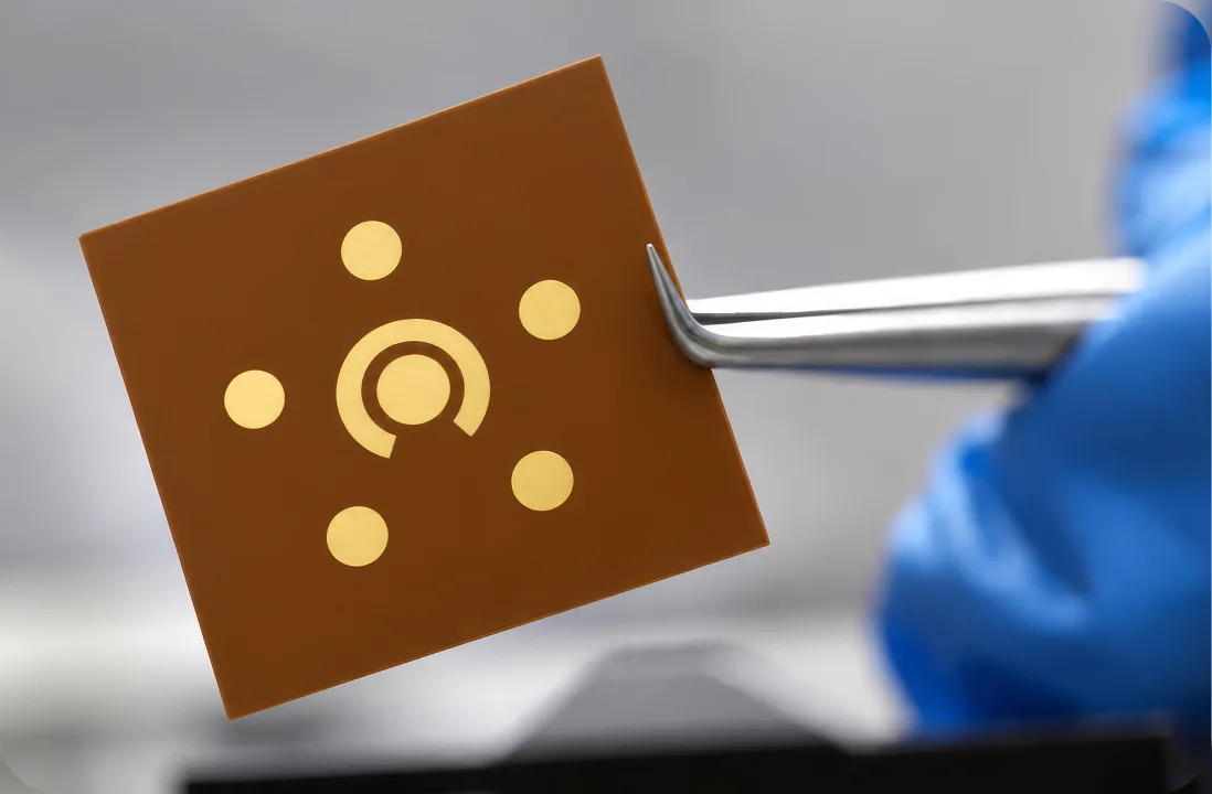 Sensor chip held in tweezers